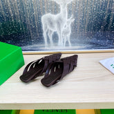 ALFIE LEATHER FLAT MULES IN CHOCOLATE BROWN PATENT CALFSKIN WITH WOVEN DESIGN